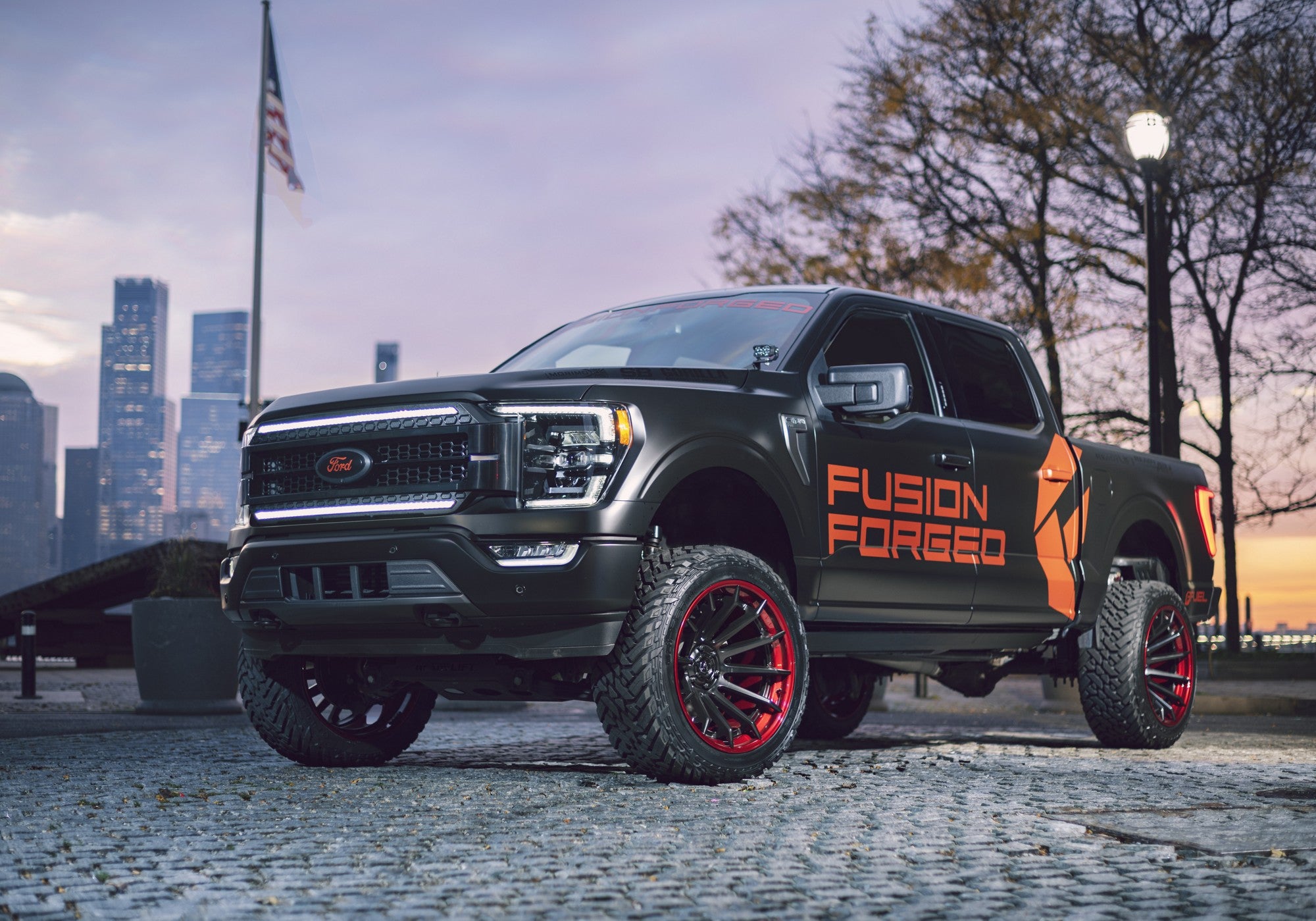 2023 Ford F150 with Fuel Off-Road Burn wheels in Matte Black w/ Candy Red Lip
