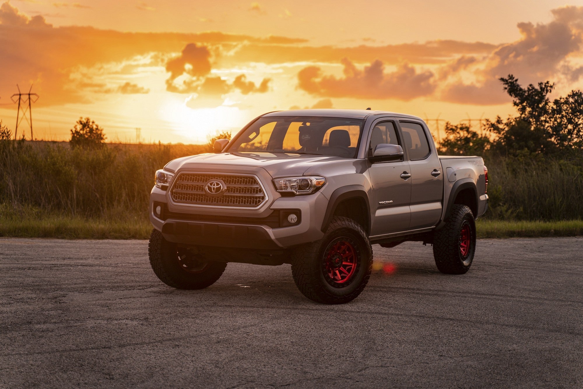 2016 Toyota Tacoma with Fuel Off-Road Covert wheels in Candy Red Black Bead Ring