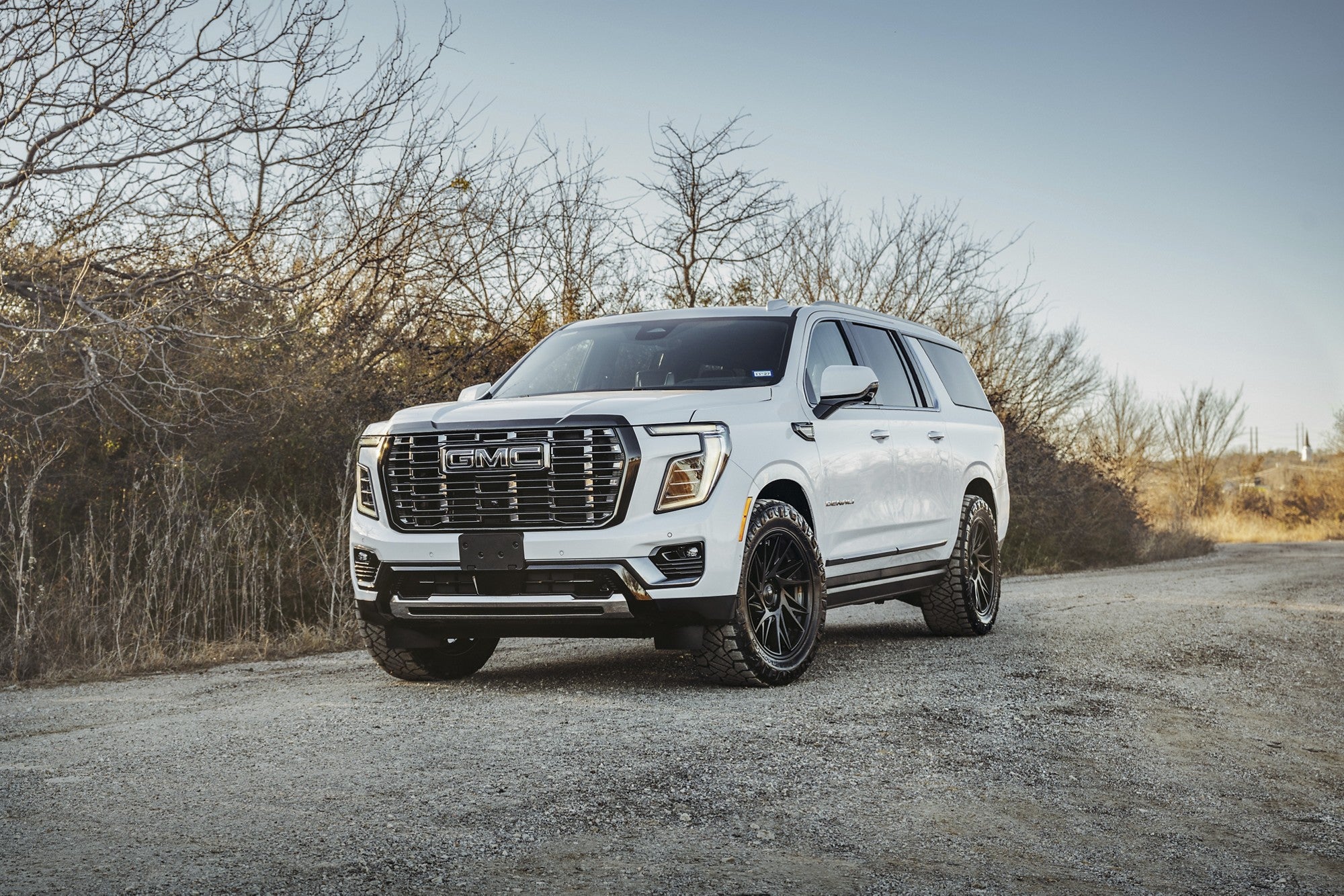 2024 GMC Yukon Denali with Fuel Off-Road Dynamo wheels in Matte Black w/ Gloss Black Lip