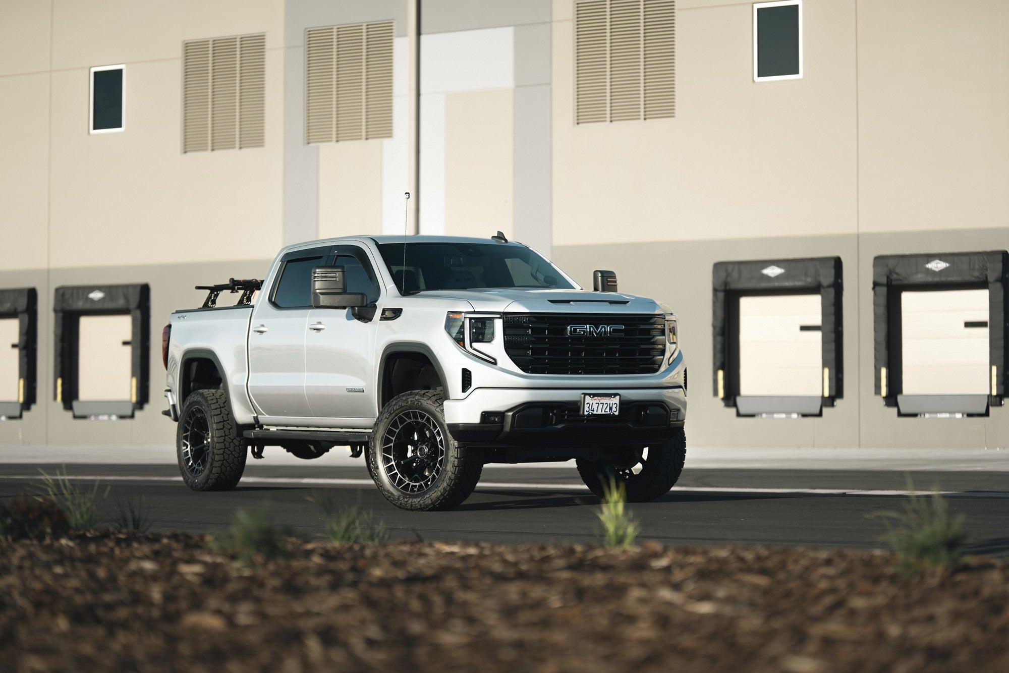 2023 GMC Sierra with Fuel Off-Road Charger wheels in Gloss Black Brushed Dark Tint
