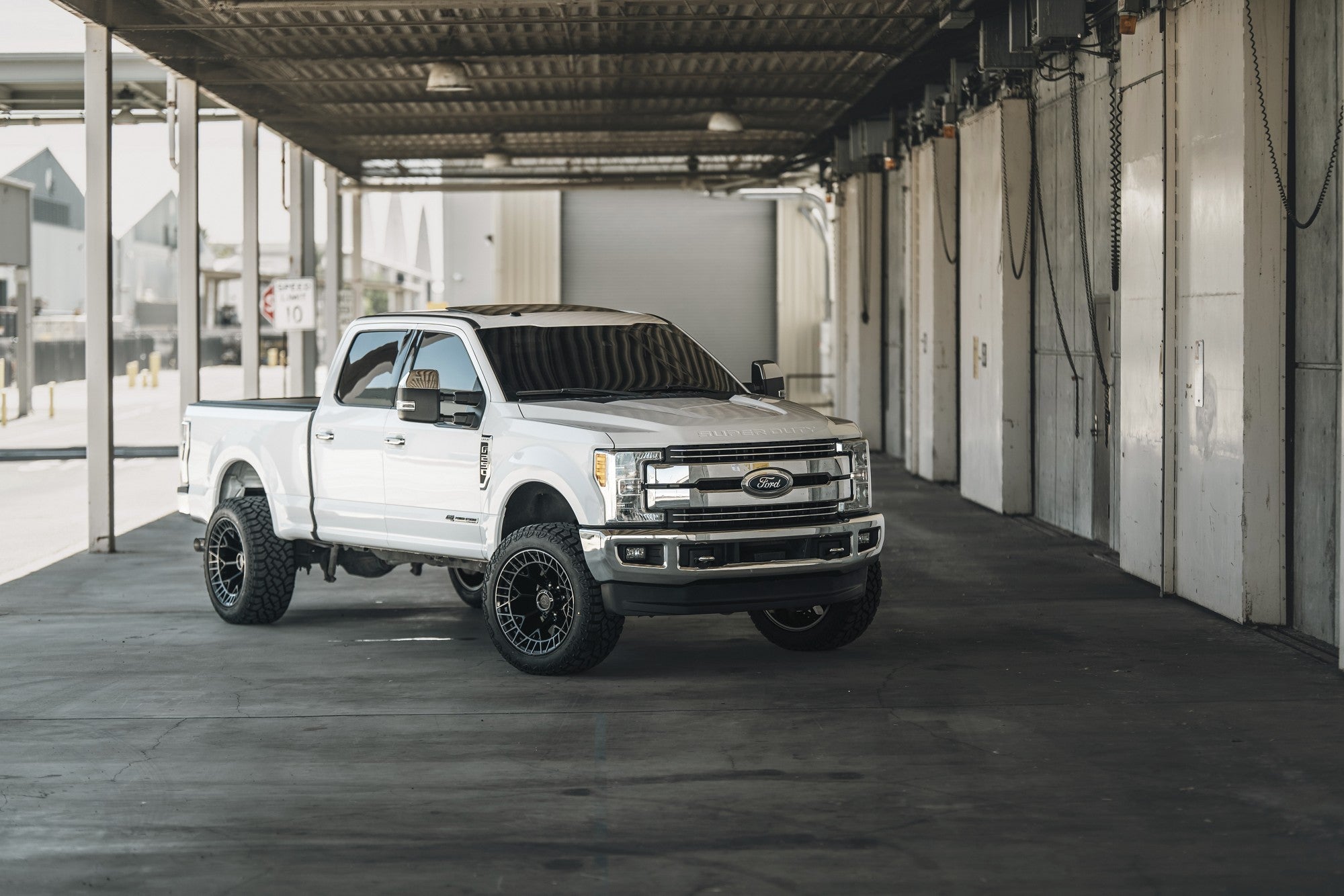 2017 Ford F250 with Fuel Off-Road Charger wheels in Gloss Black Brushed Dark Tint