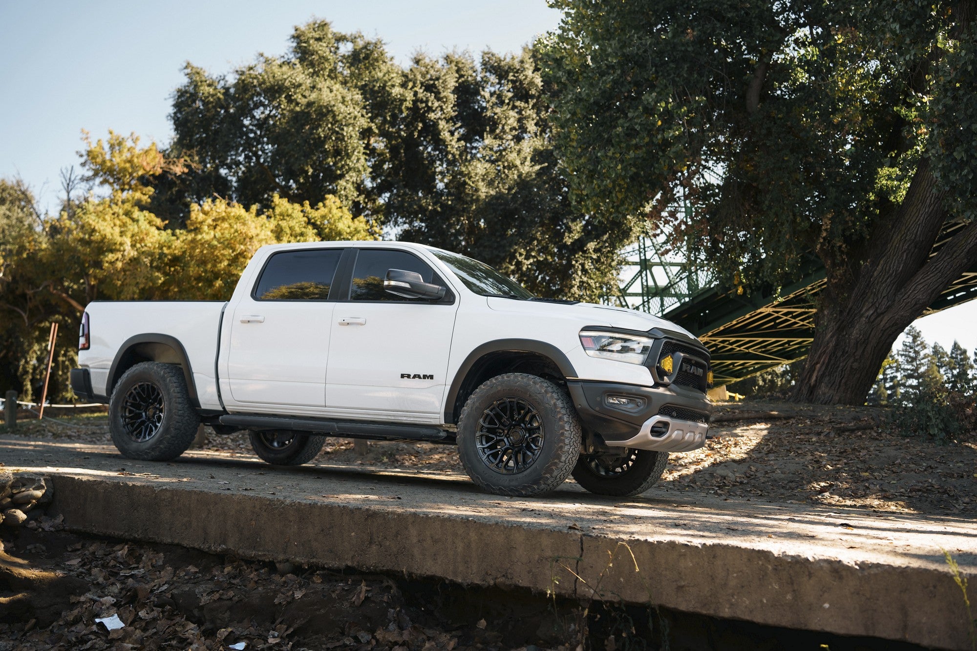 2024 Ram 1500 Rebel with Fuel Off-Road Chisel wheels in Blackout