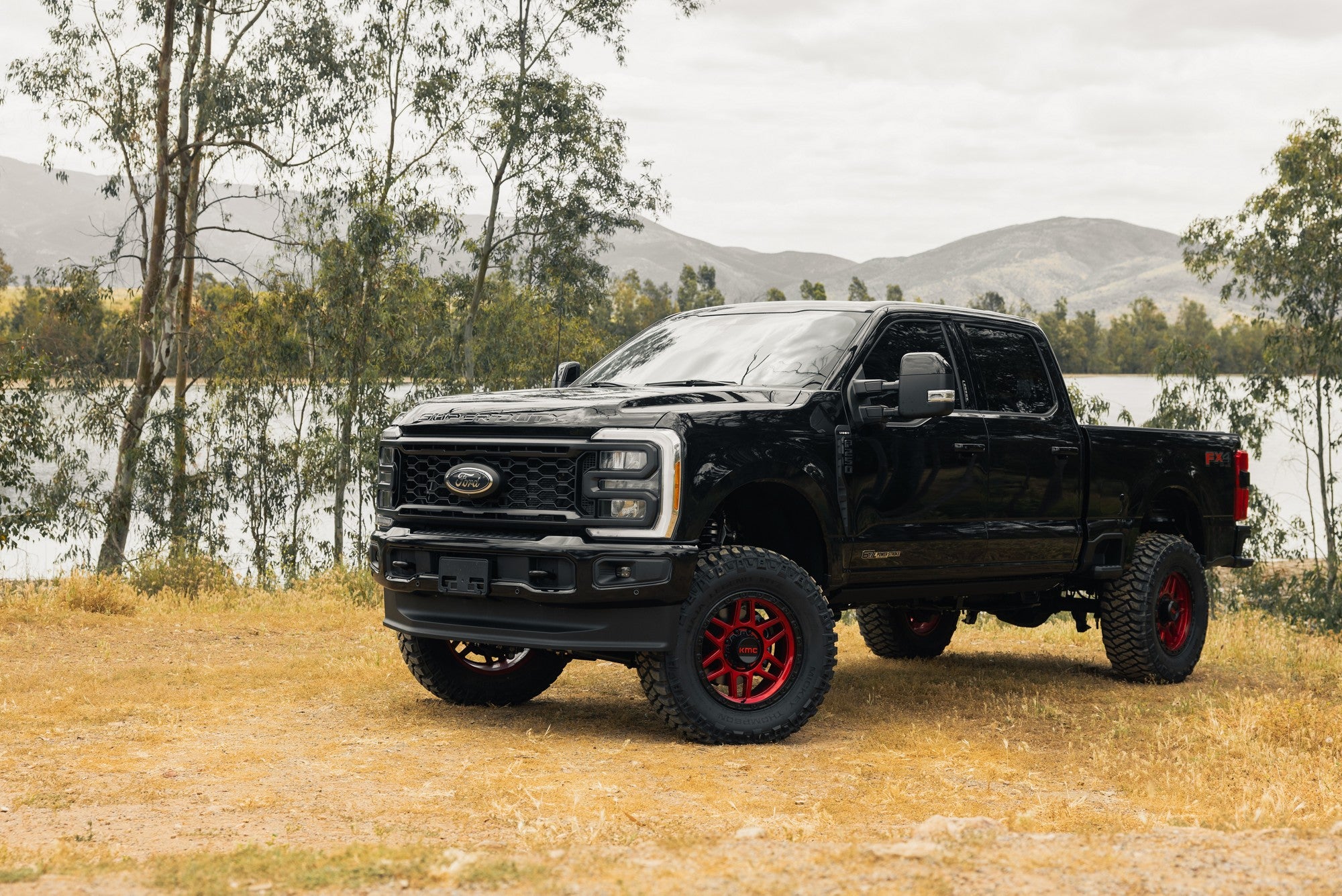 2022 Ford F250 with KMC Mesa wheels in Candy Red w/ Black Lip