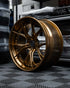 MV Forged SL-102 Spoke-Lite forged wheel, 3-piece in a gold finish on a display shelf