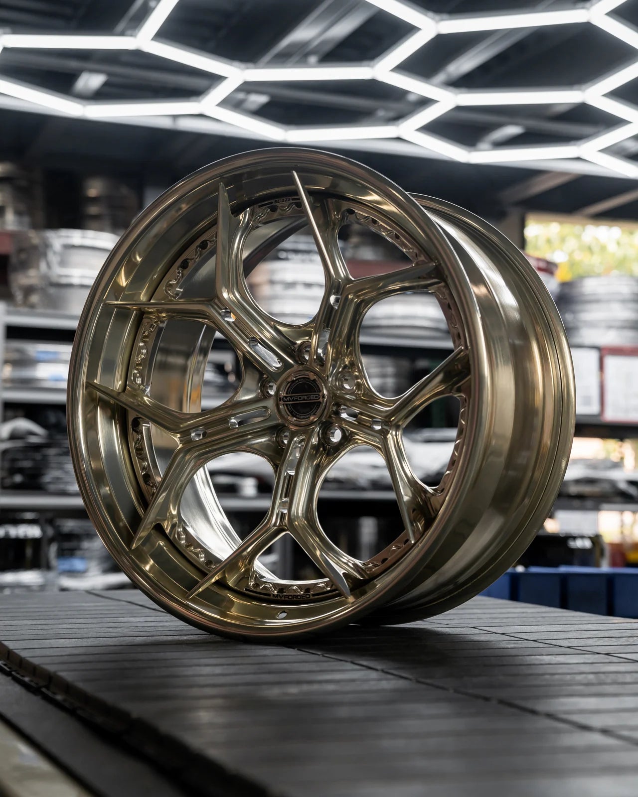 MV Forged SL-171 Spoke-Lite forged wheel, 3-piece in a bronze finish on display