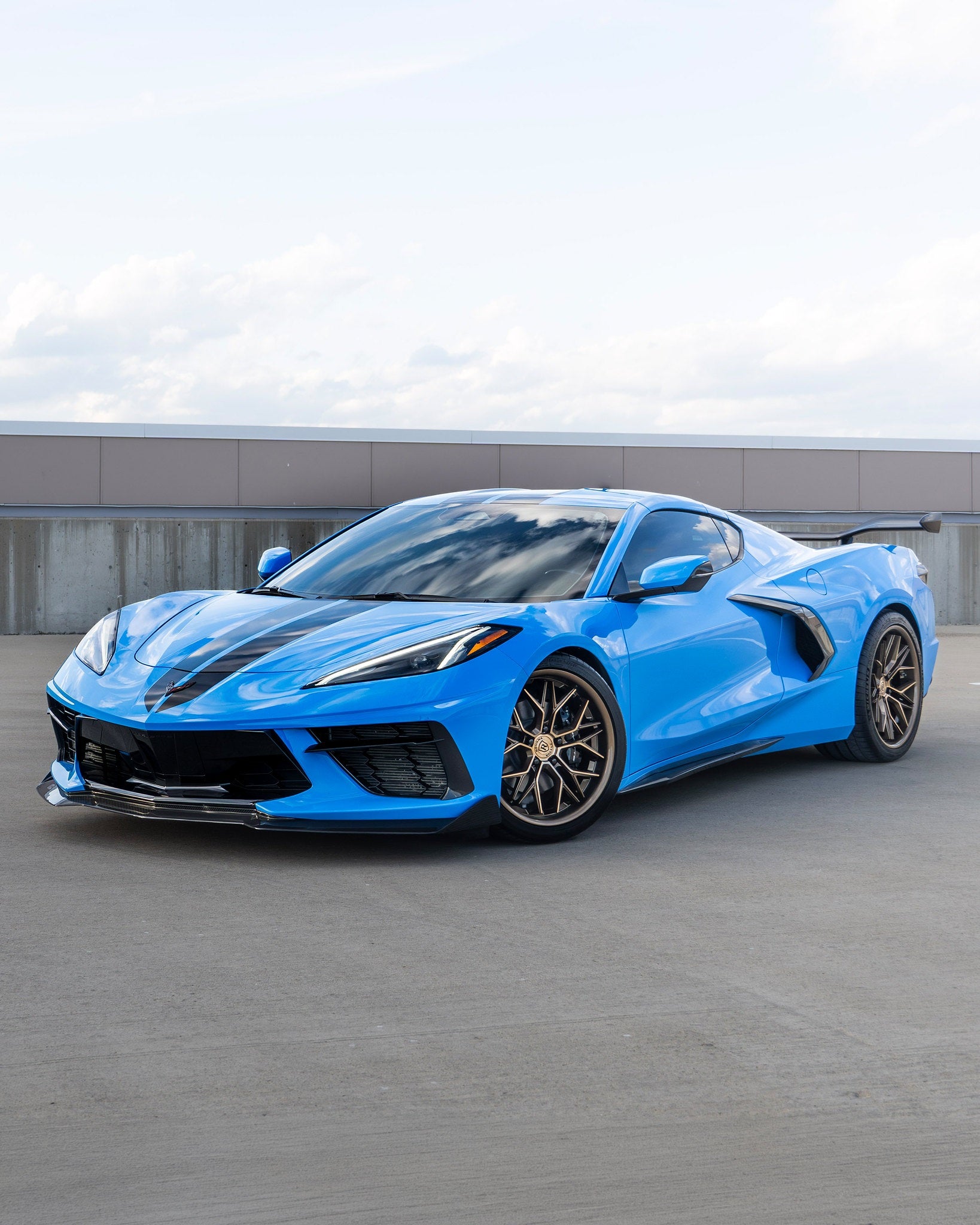 Rohana RFC3 Machine Bronze on a Blue C8 Corvette